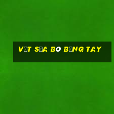 vắt sữa bò bằng tay